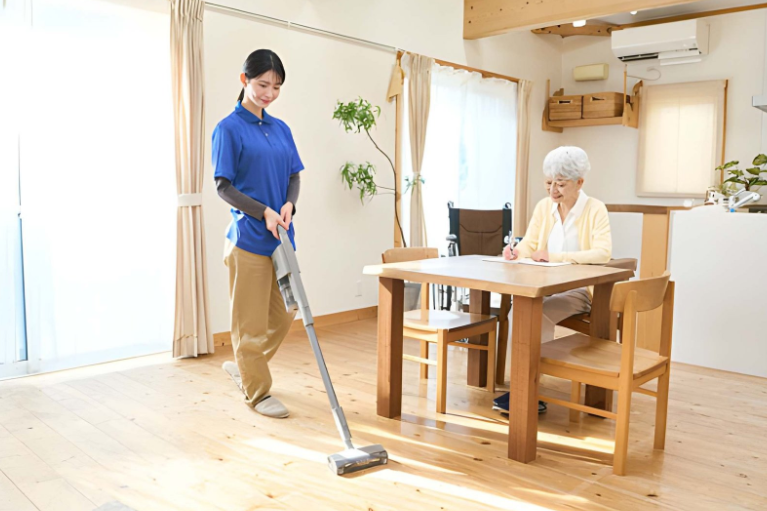 cleaning lady helping out elderly with house cleaning