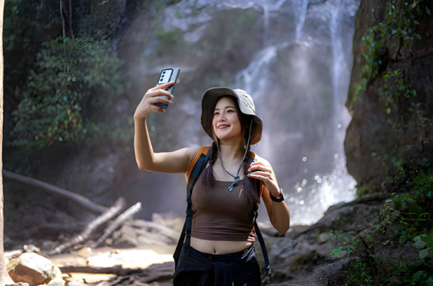 visiting waterfall taking pictures